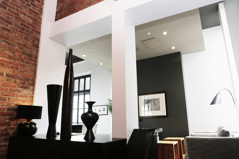 stylish home with tall ceilings and brick walls