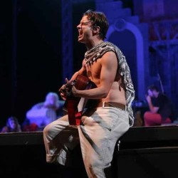 Man on Stage playing guitar