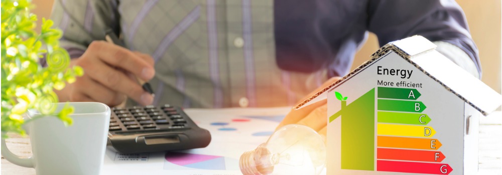 men-who-are-calculating-cost-savings-from-energy-hand-holding-a-pen-picture